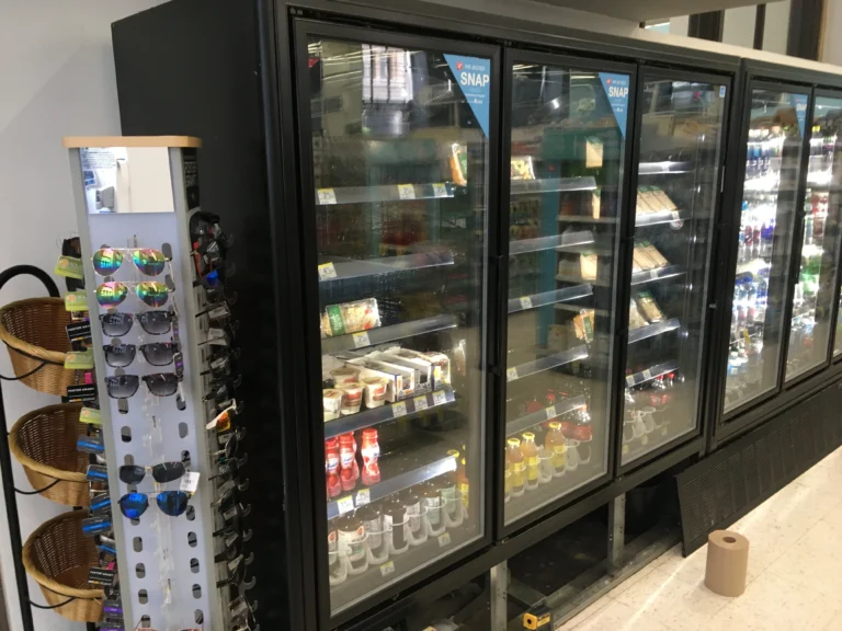 Row of glass-door merchandisers in a Bay Area store